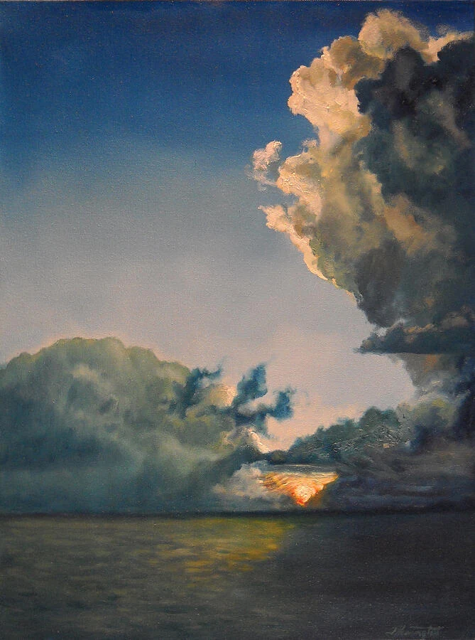 A golden opening appears between towering clouds above a dark sea.