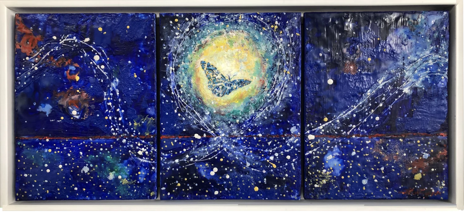 A butterfly and radiant shapes span three blue and gold panels within a light-colored frame.