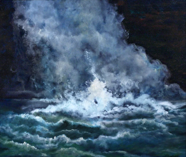 Foaming water churns against dark blue-green waves and rock.