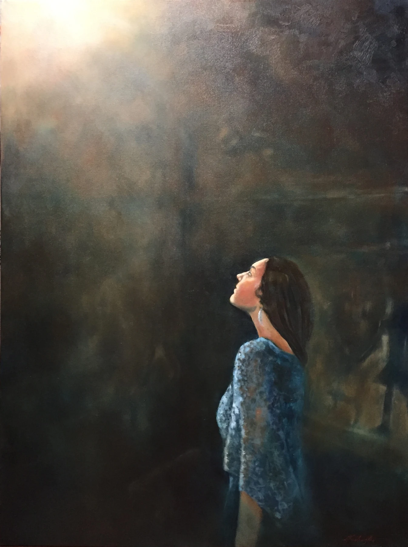 A woman looks upward toward a soft opening of golden light in a dark, atmospheric landscape.